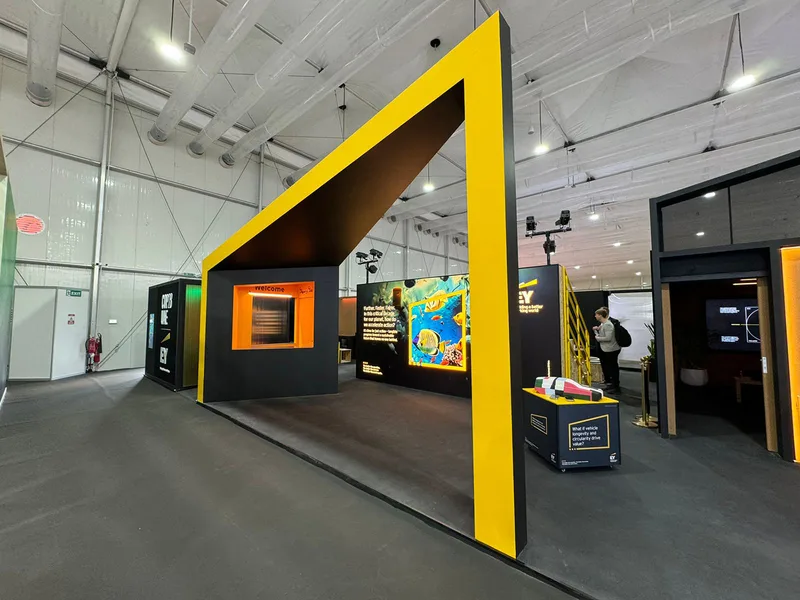 cop28-ey-stand-yellow-arch-entrance-2023