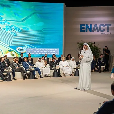 enact-majlis-panel-discussion-speaker-stage-uae.webp