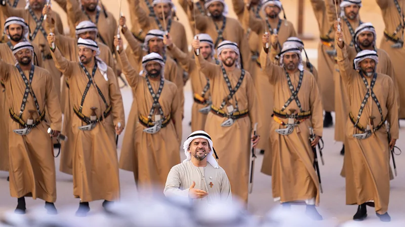 al-wathba-tribal-parade-riflemen-raising-arms-2024