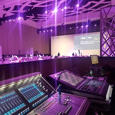 front-of-house-mixing-console-conference-gala-purple-lighting-dubai-uae-audio-production.webp