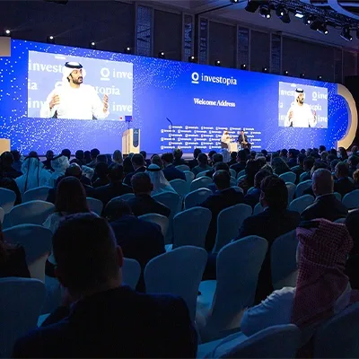 investopia-welcome-address-conference-stage-uae
