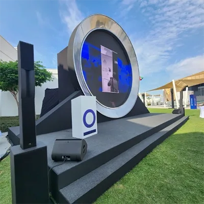 outdoor-stage-circular-led-screen-podium-speakers-dubai-uae-event-production.webp