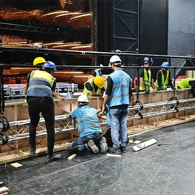 stage-crew-assembling-truss-and-flooring-uae