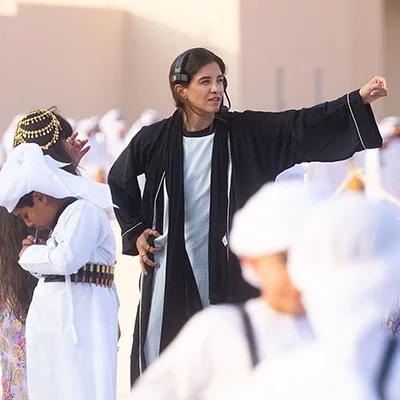 uae-parade-director-guiding-children-performers-uae